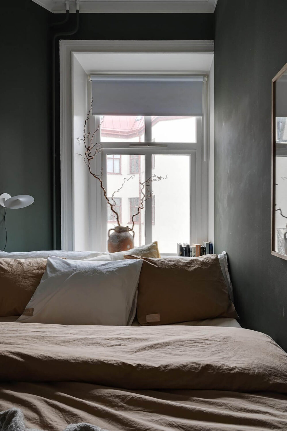 A Gothenburg Apartment with a Small Dark Green Bedroom 23 small window dark bedroom