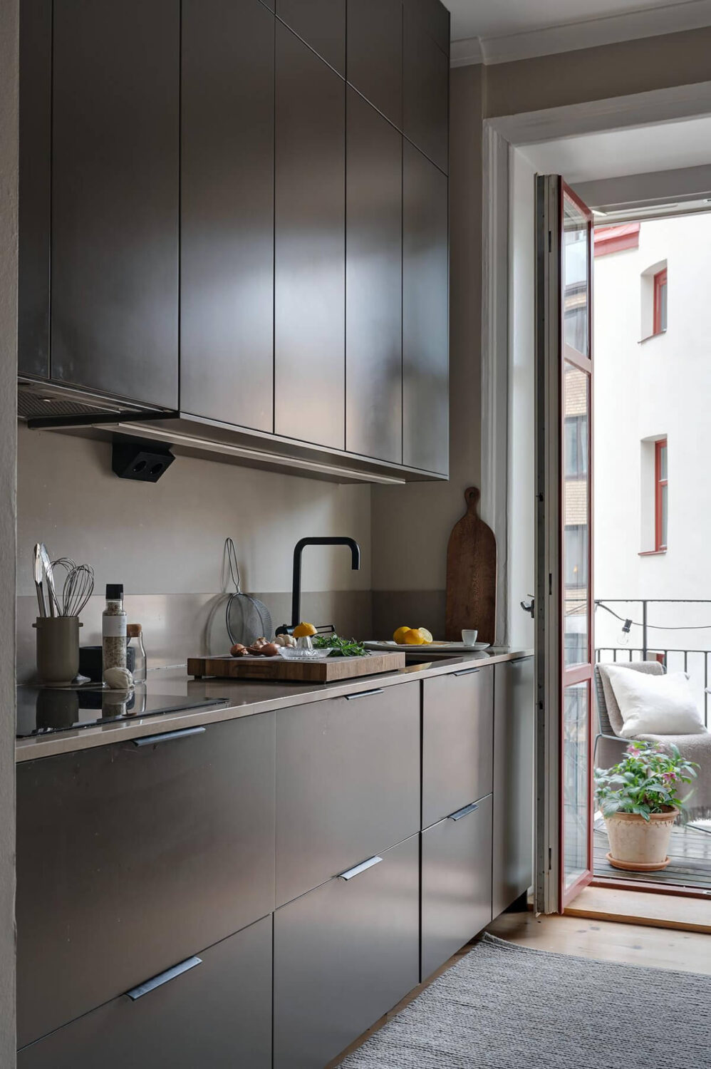 A Gothenburg Apartment with a Small Dark Green Bedroom 14 stylish black kitchen