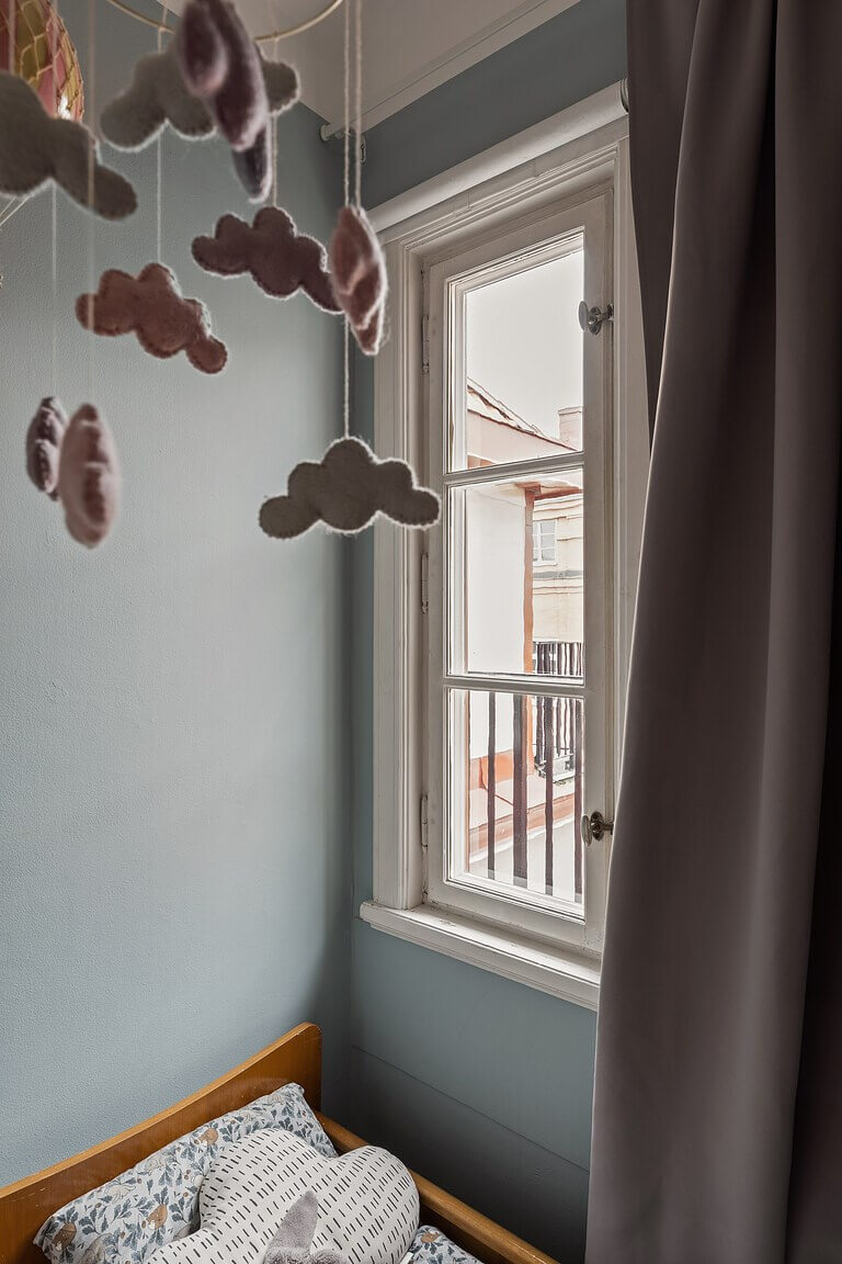 A Stockholm Apartment with a Light Yellow Kitchen 22 tiny blue nursery
