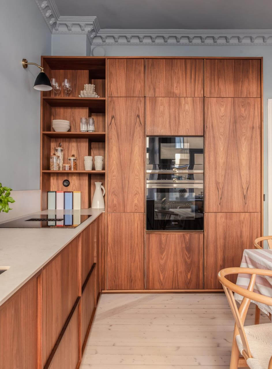 Pastel Colors and Contemporary Design in a Late 19th Century Apartment 13 walnut kitchen cabinets