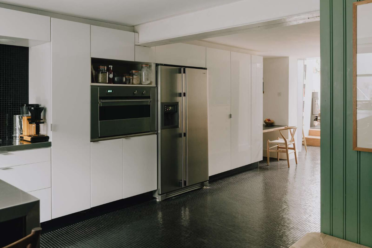 A London Basement Apartment in a Former Wood Workshop 14 white kitchen high cabinets