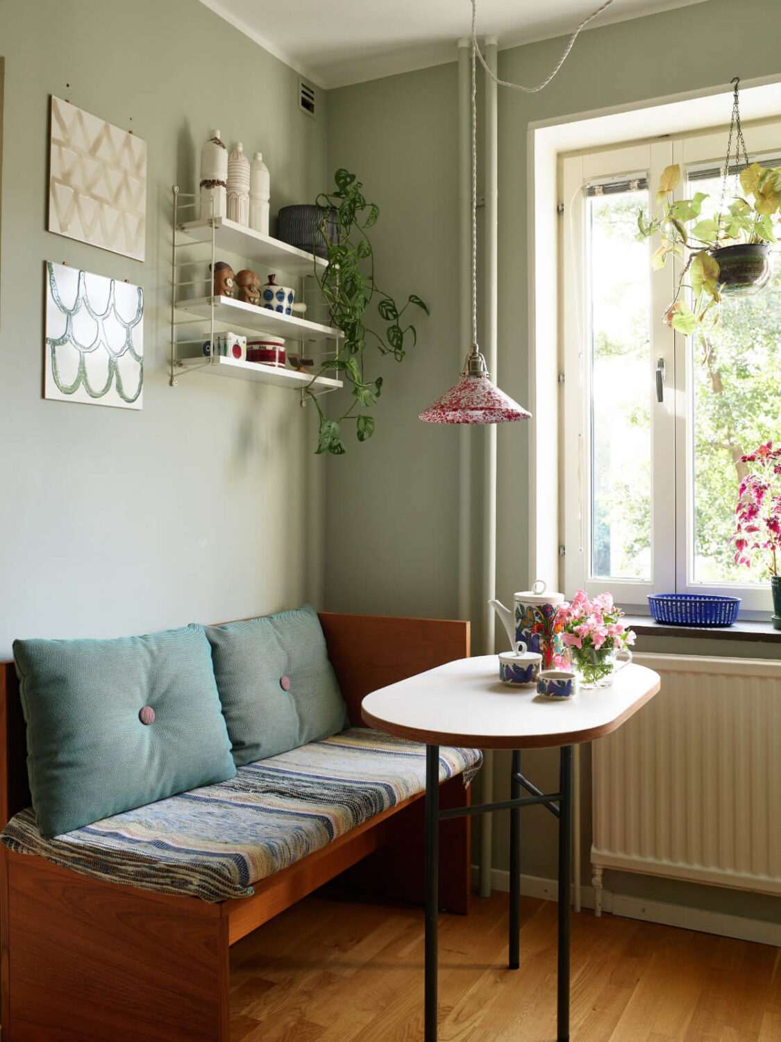 A Lovely Color Palette in a Midcentury Apartment in Sweden 17 wooden bench breakfast table