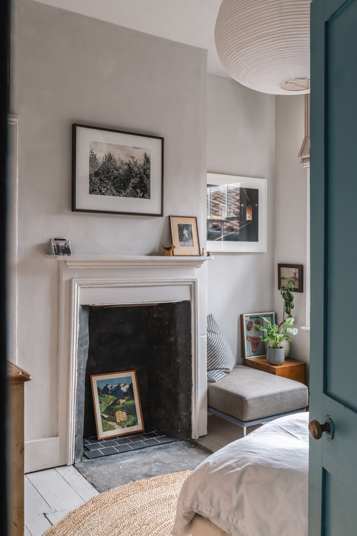 A Cozy Victorian Home Painted in Moody Blue and Gray Tones 22 bedroom fireplace
