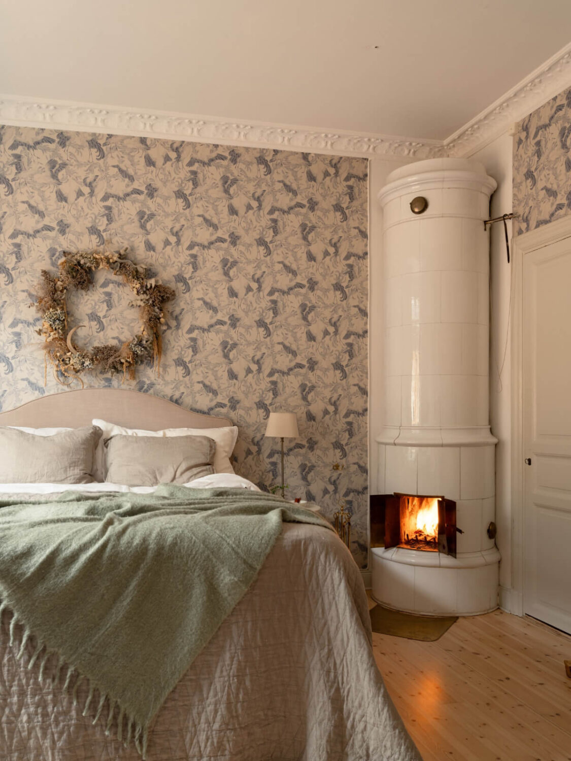 Soft Color Tones in a Renovated Turn-of-the-Century Apartment 20 bedroom with fireplace
