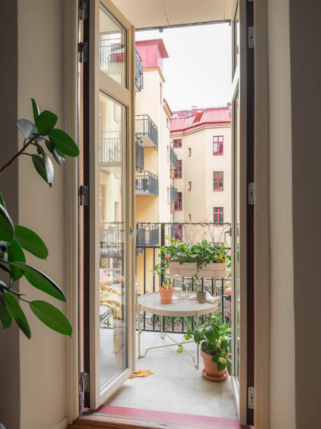 A Calm Color Palette in a Charming Swedish Apartment 10 glass balcony doors