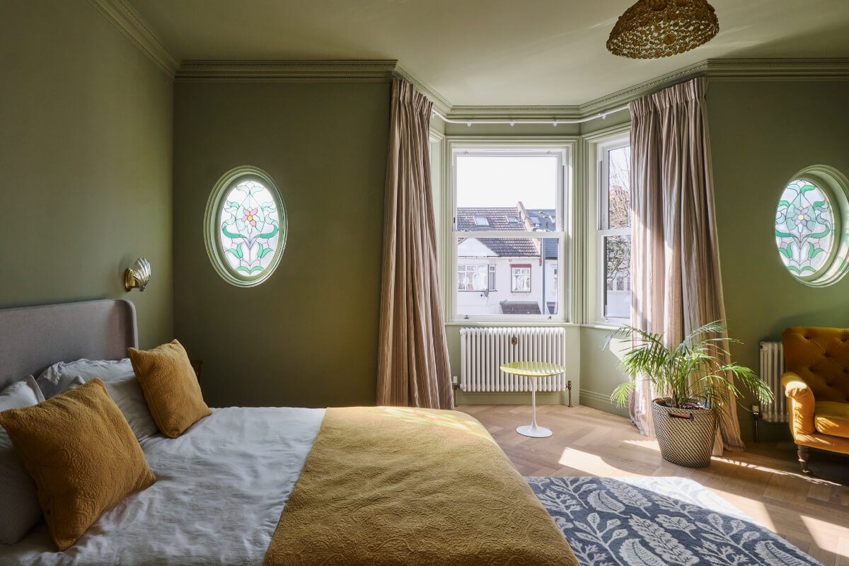 A Beautiful Extended Edwardian House Blends Period Features with Modern Design 17 green bedroom bay window