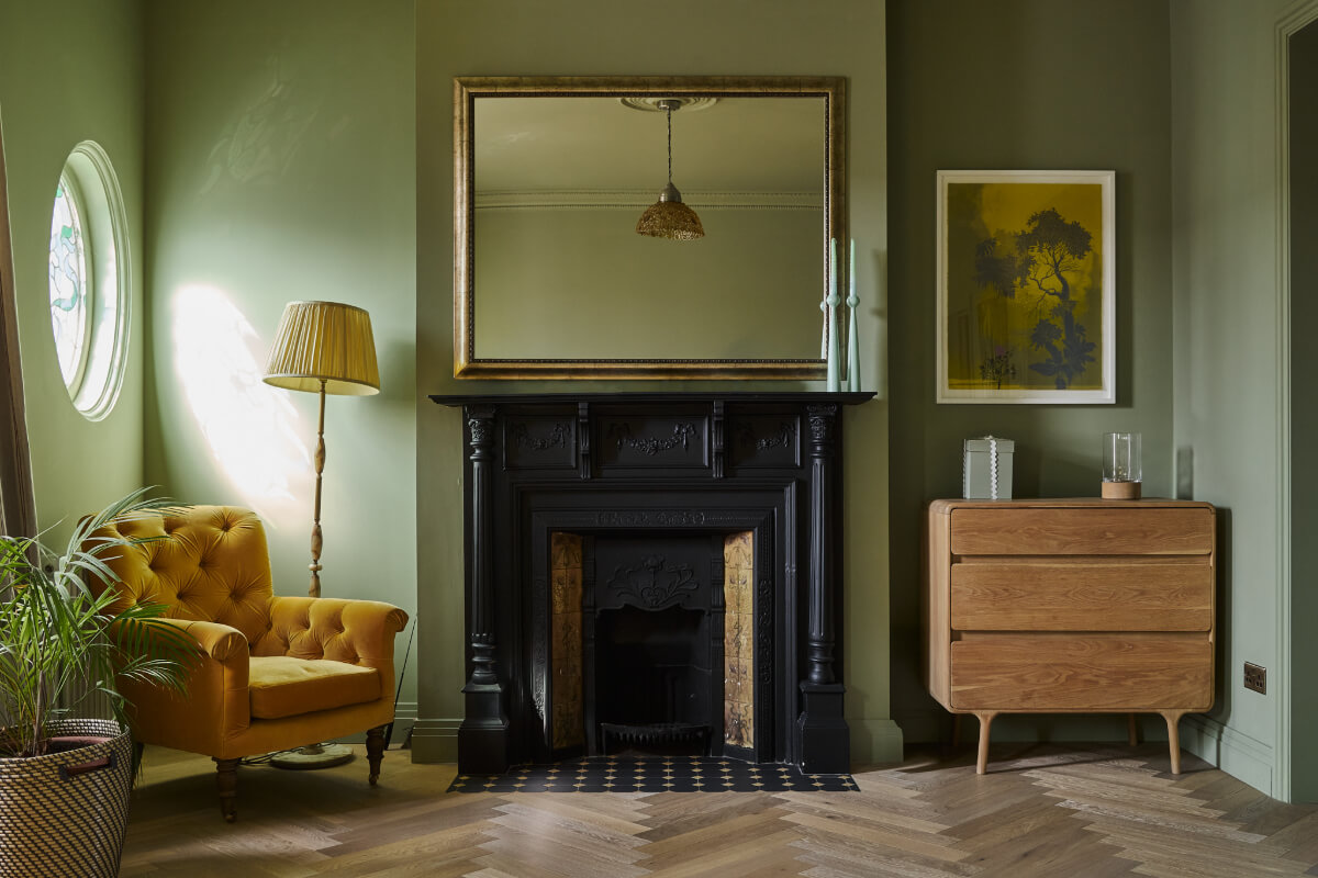 A Beautiful Extended Edwardian House Blends Period Features with Modern Design 19 green bedroom fireplace
