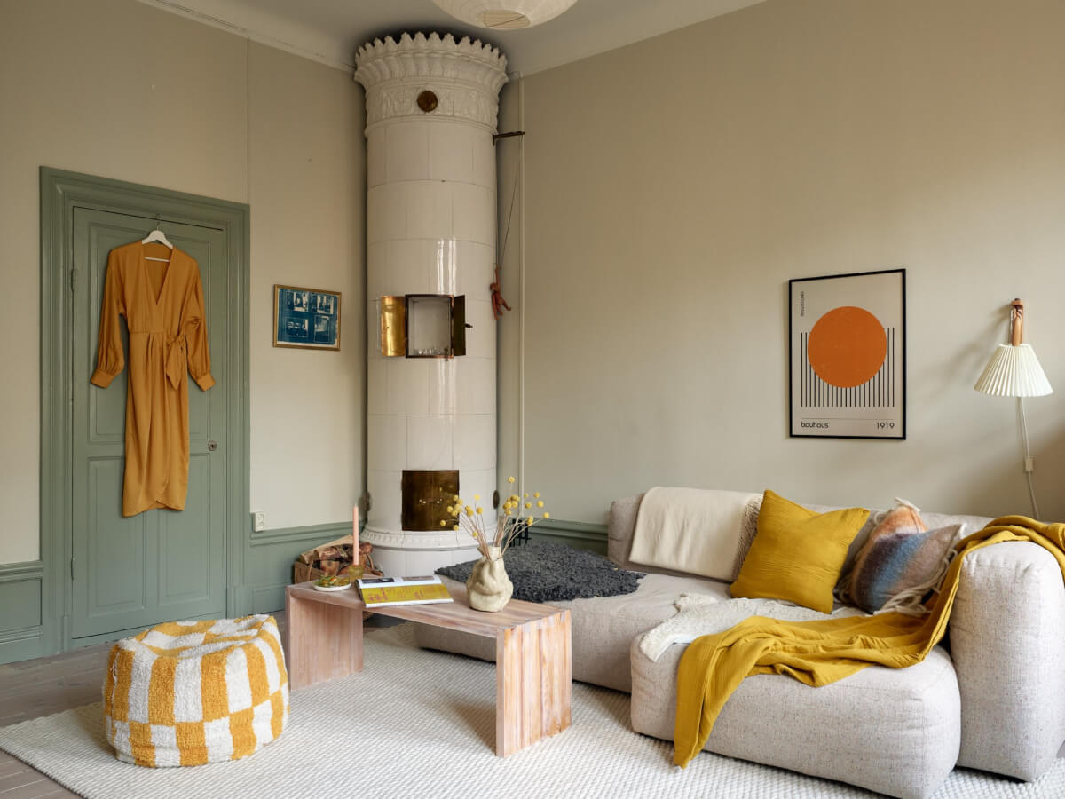 green joinery living room yellow color accents fireplace
