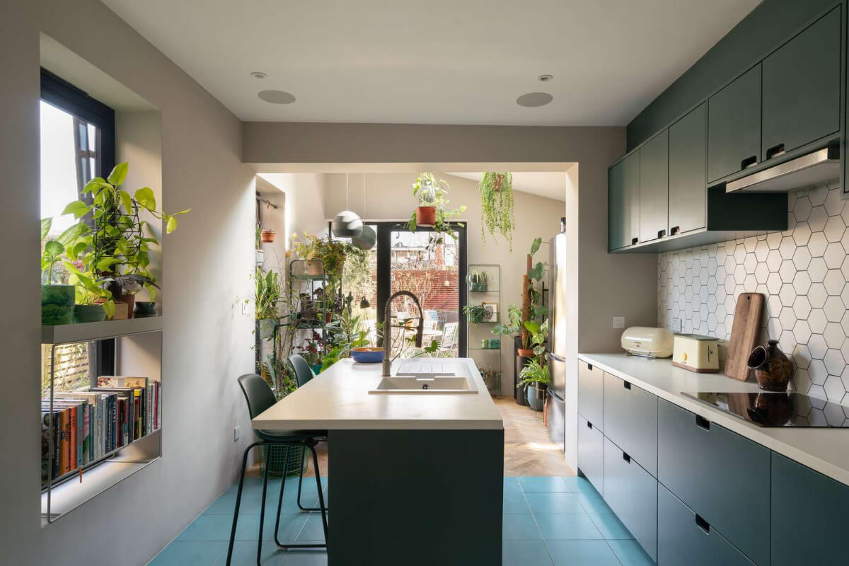 A Colorful Home with a Gold Extension in North London 1 kitchen with island and blue tiles