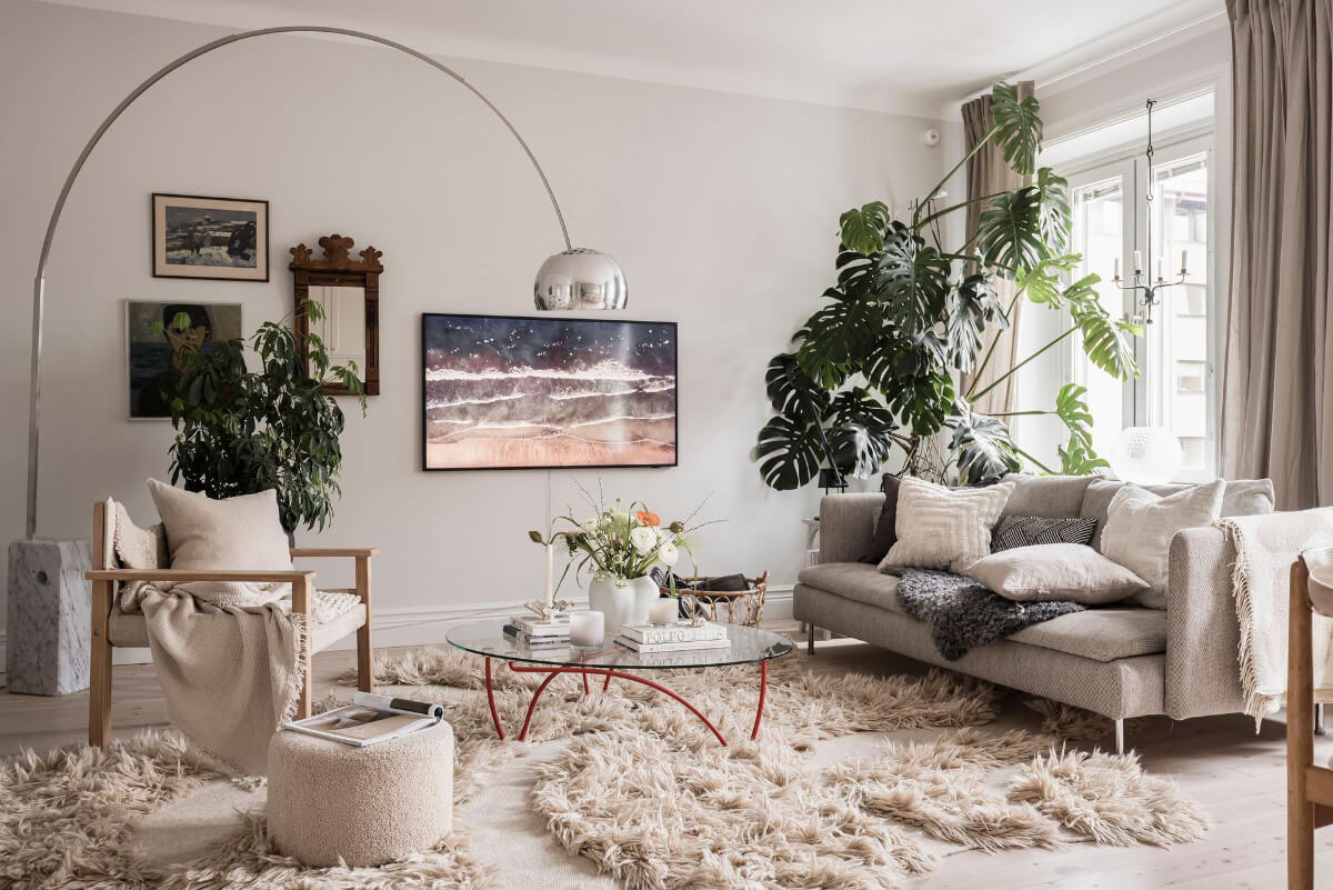 A Light Color Palette in a Stylish Renovated Late 19th Century Apartment 1 living area plants cozy rug