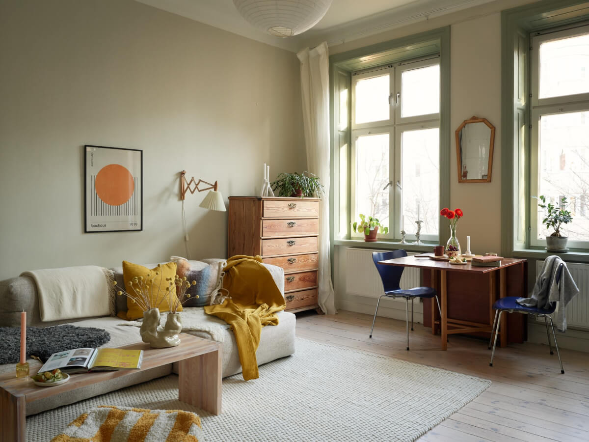 A Muted Color Palette and Smart Storage in a Small Stockholm Apartment 2 living room green joinery