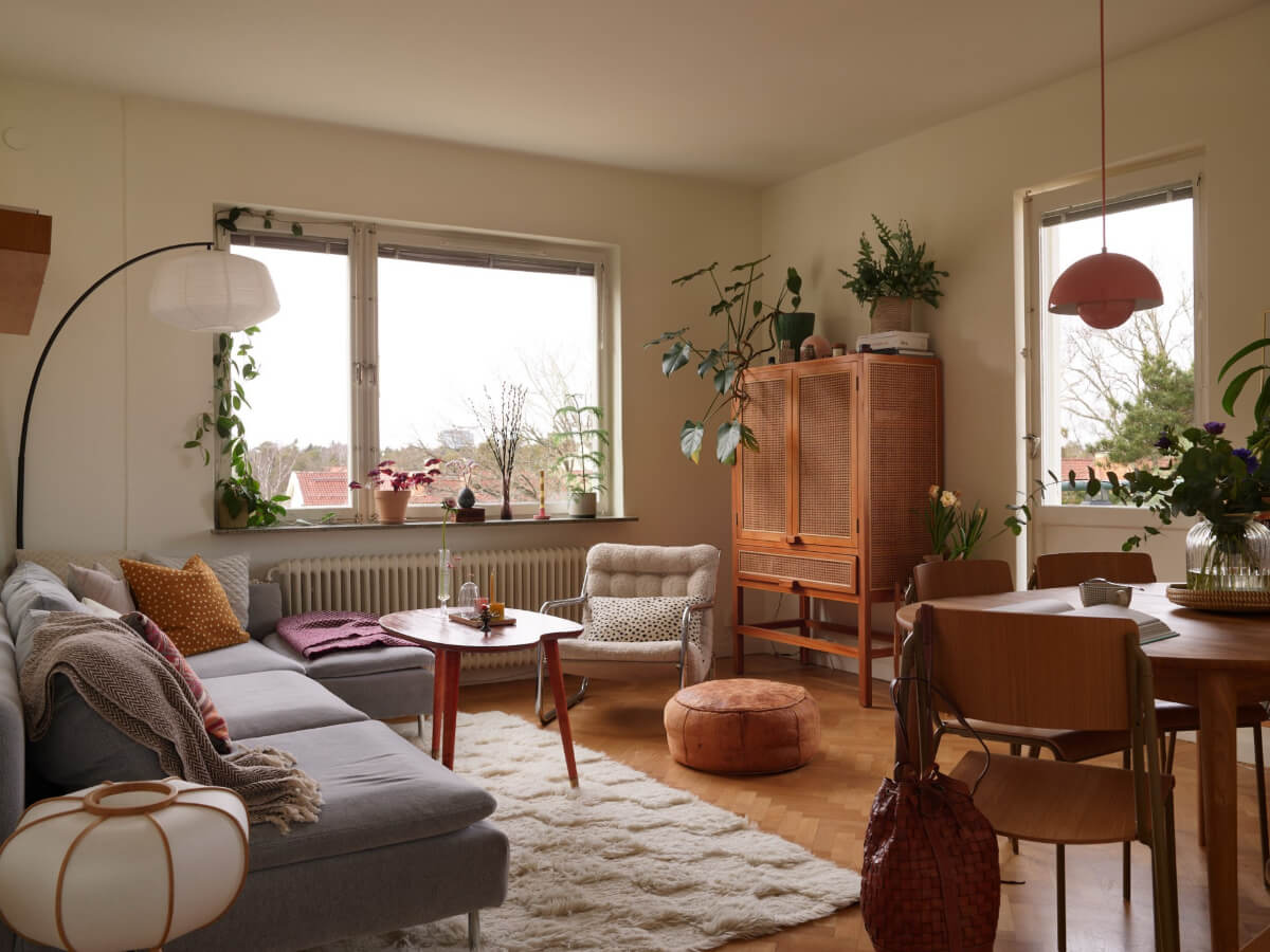 A Renovated 1940s Apartment with Colorful Bedrooms 1 living room herringbone parquet floor round table