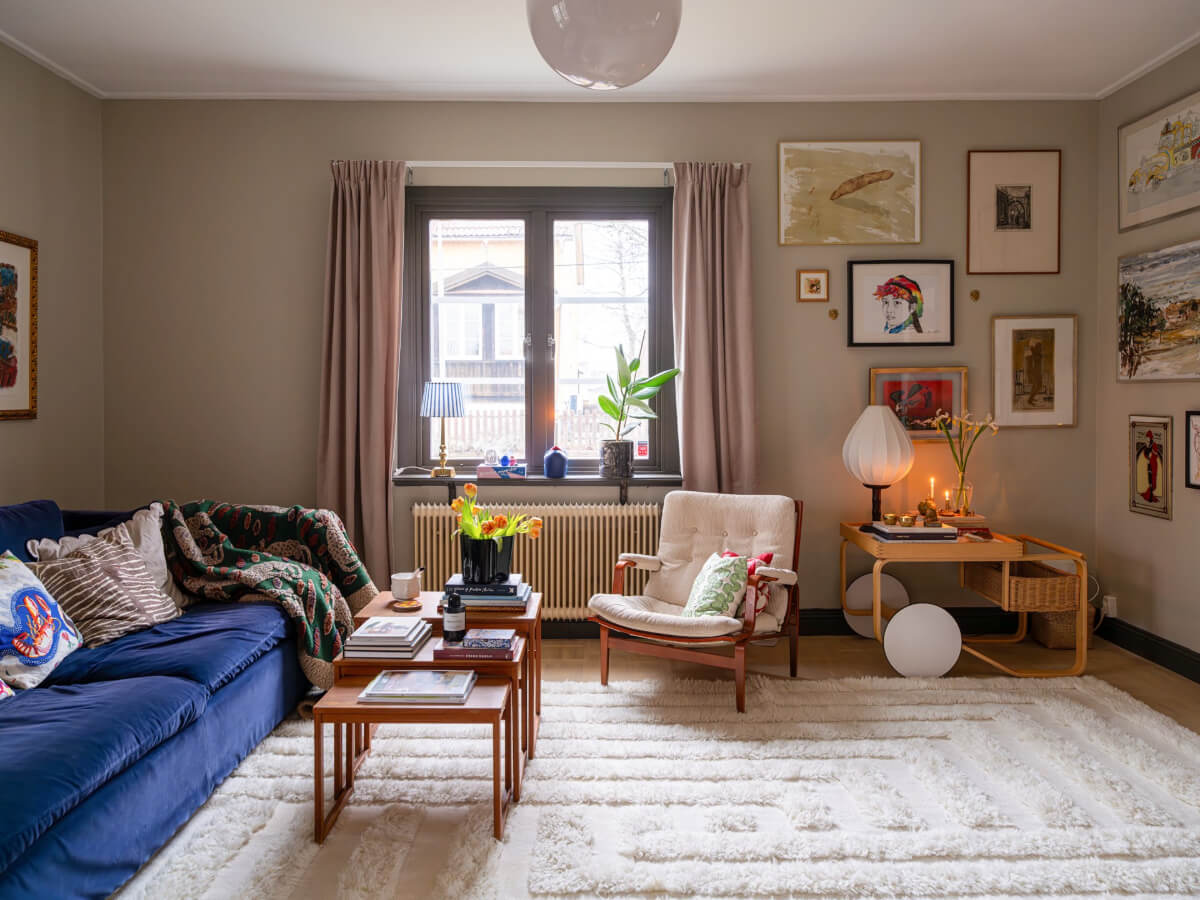 A Beautiful Renovated Family Home with a Charming Garden 1 living room large rug gray walls art