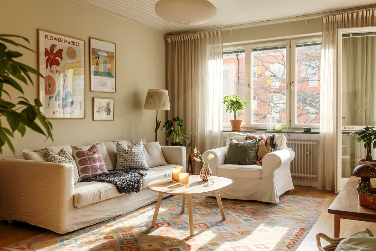 A Two-Bedroom Apartment with the Original Midcentury Kitchen 1 living room sunlight colorful rug