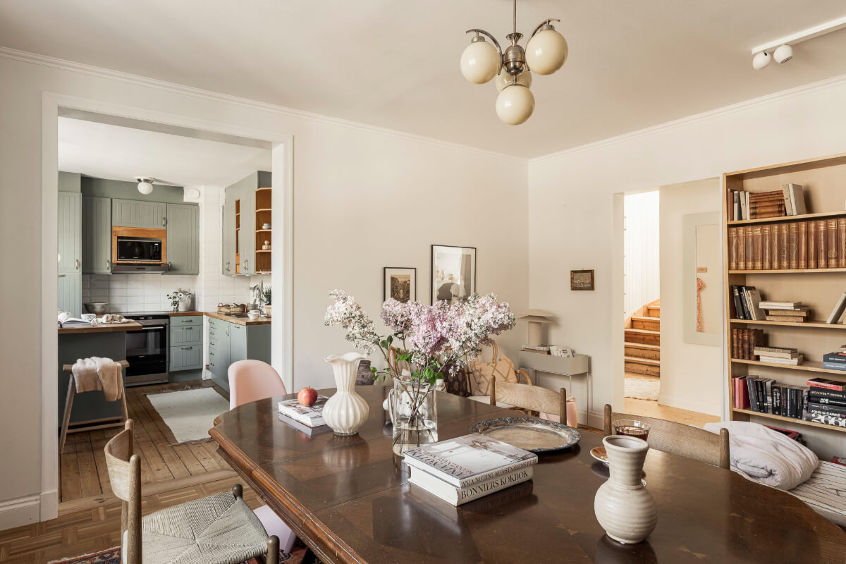 A Swedish Duplex Apartment Inspired by A Danish Summer House 19 open-plan kitchen and dining room antique table
