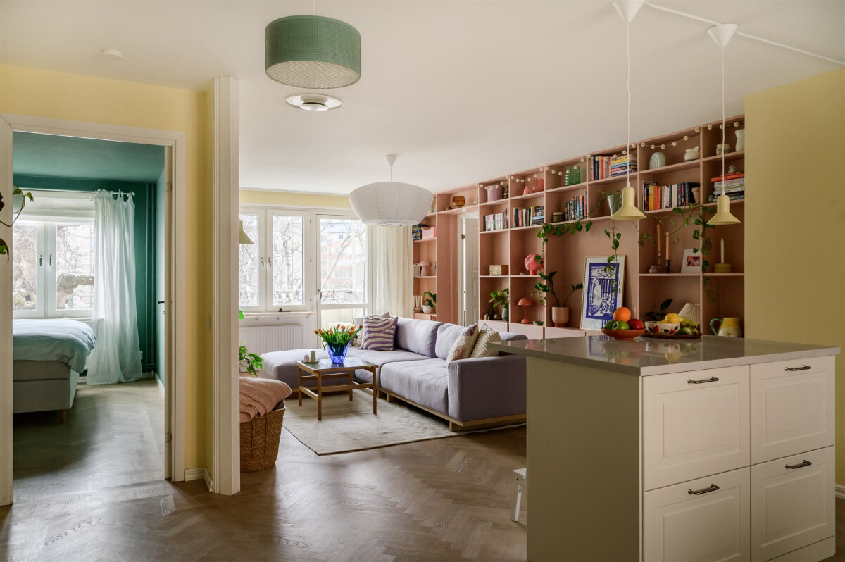 Colorful Rooms in a Bright Two-Bedroom Stockholm Apartment 1 pastel colored living room bookcases