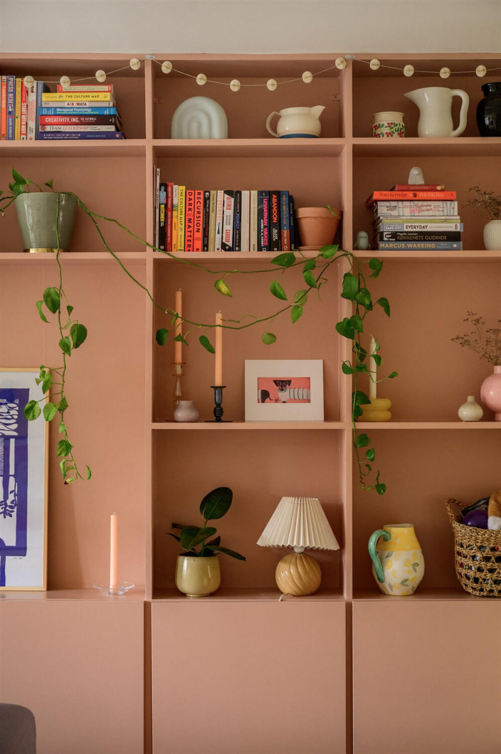 Colorful Rooms in a Bright Two-Bedroom Stockholm Apartment 3 pink bookshelves
