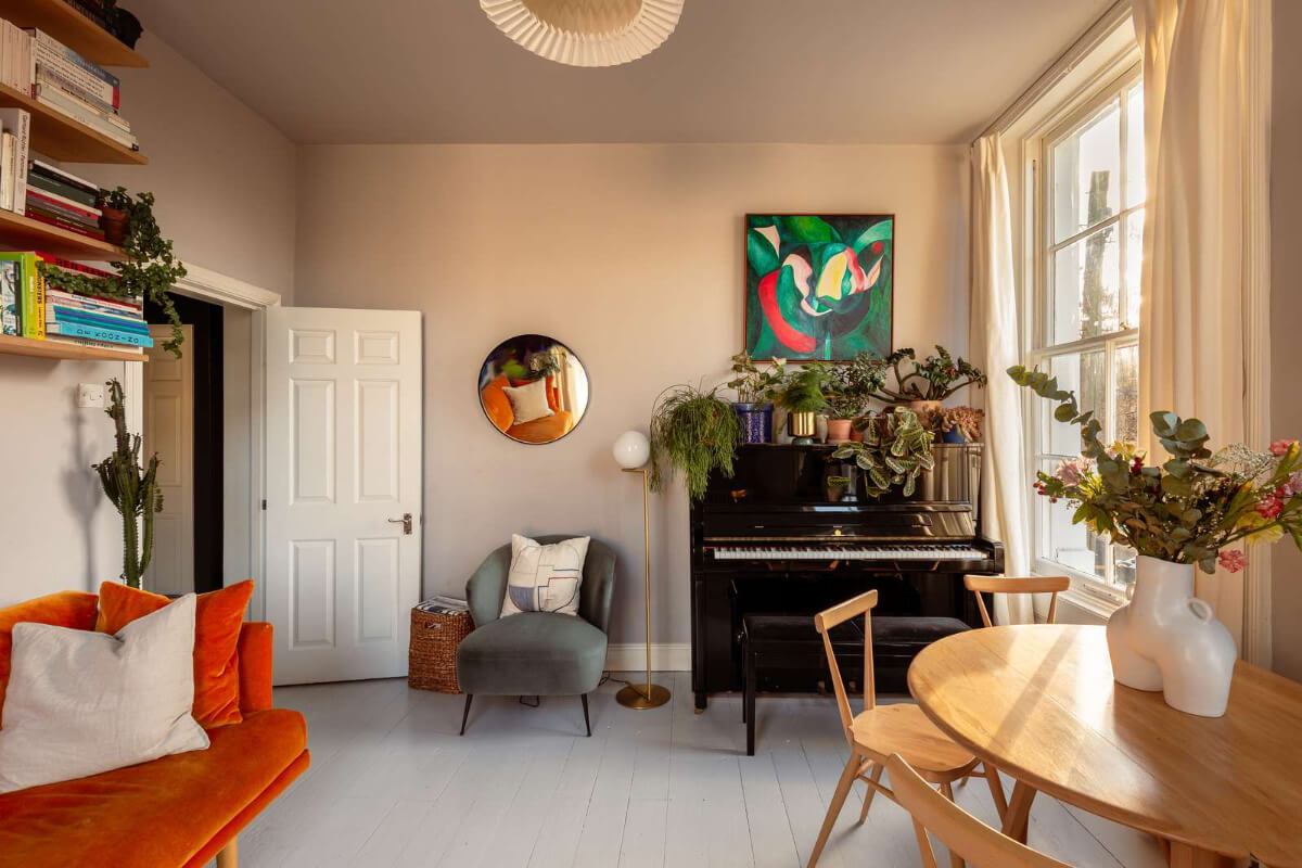 A Corner Apartment with Large Windows in a Former London Pub 5 serene living room painted floorboards piano