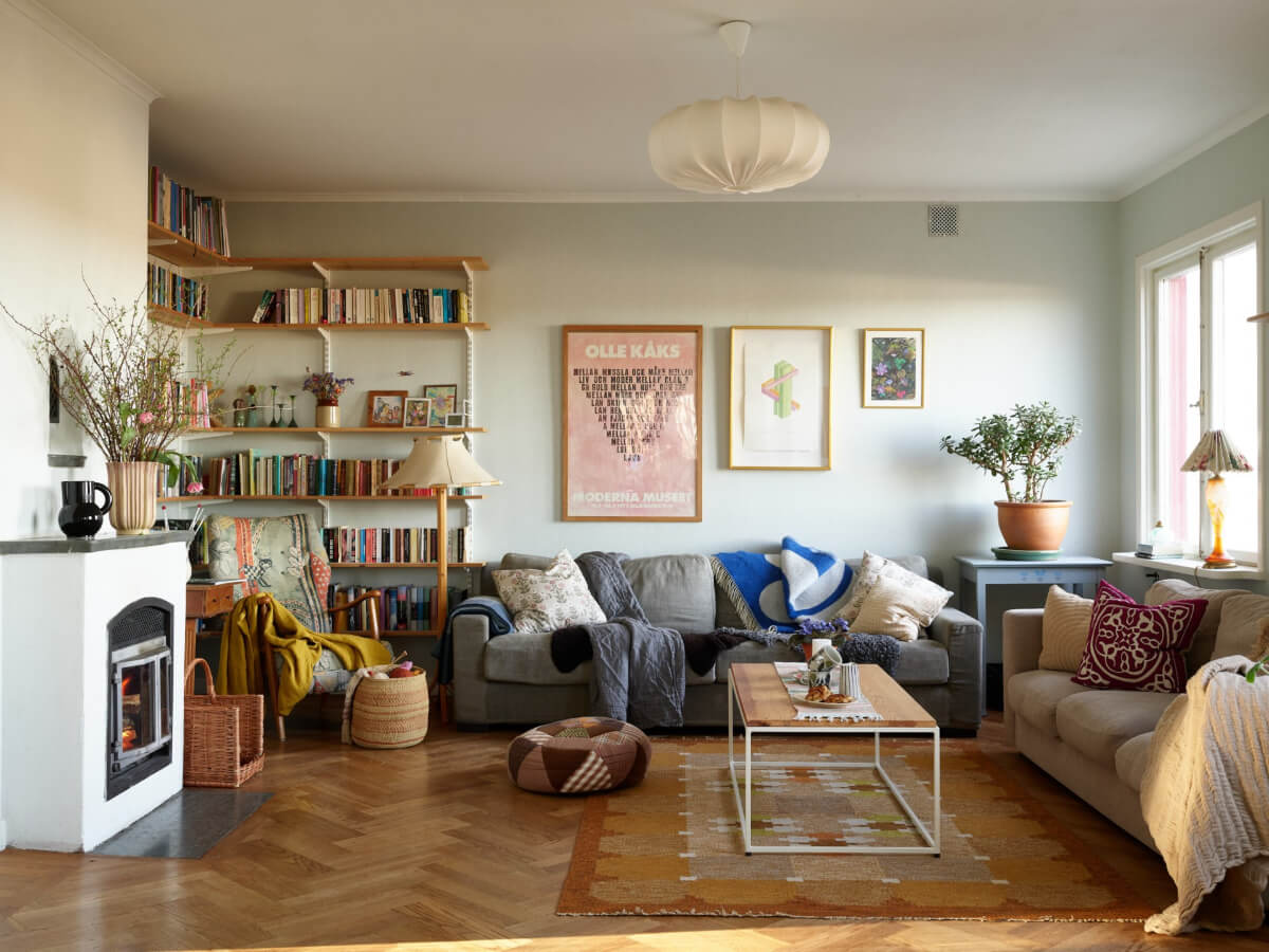 sitting room with bookshelves and fireplace