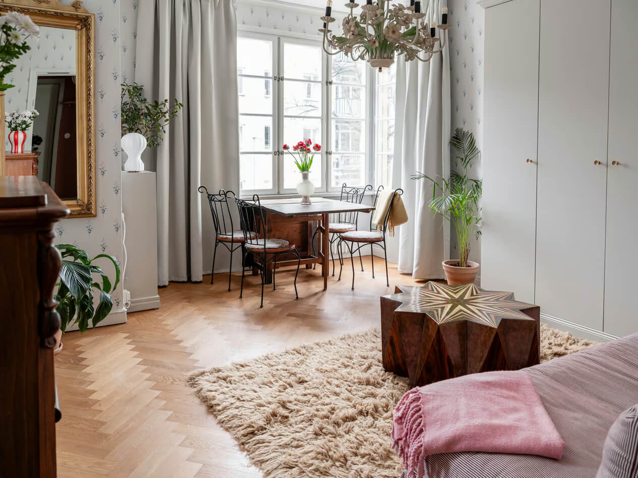 A Charming Small Apartment with a Cozy Bedroom Niche 1 small living room bay window herringbone parquet floor