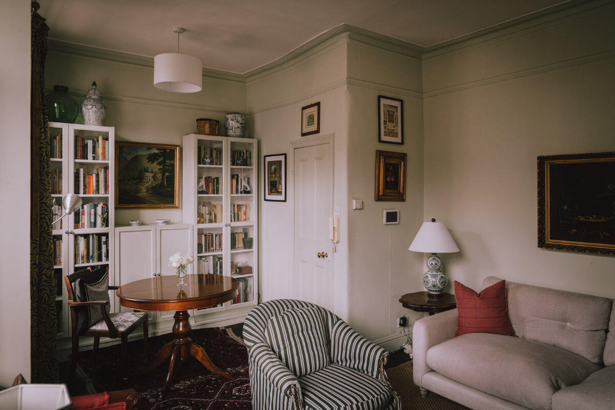 A Carefully Restored Edwardian Apartment with a Garden 4 small living room with antique table