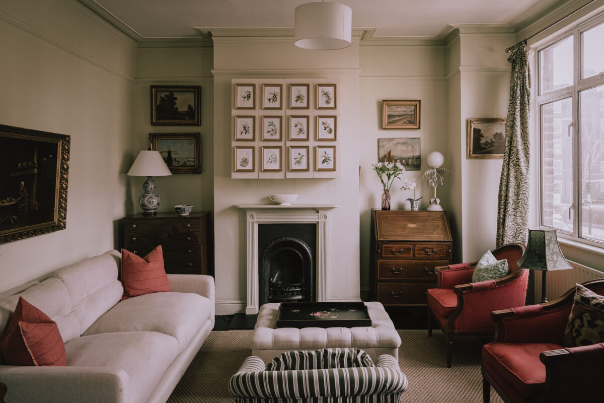 A Carefully Restored Edwardian Apartment with a Garden 1 small muted living room fireplace