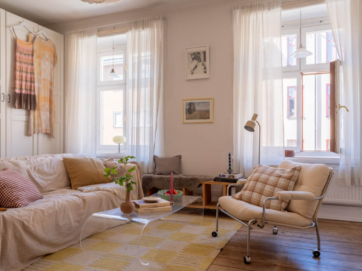 small scandi living room rustic wooden floorboards yellow rug