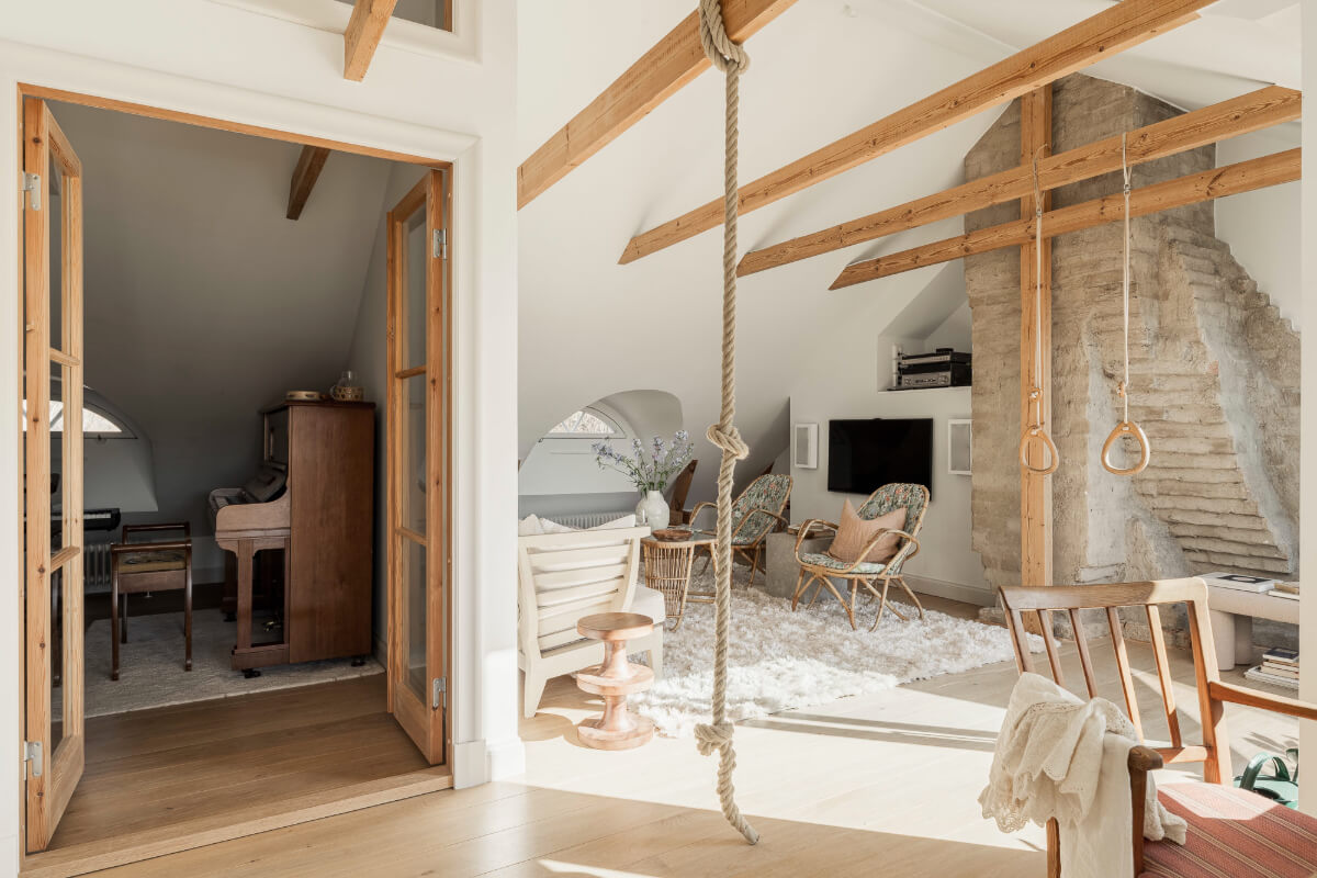 A Swedish Duplex Apartment Inspired by A Danish Summer House 11 top floor living space wooden beams music room