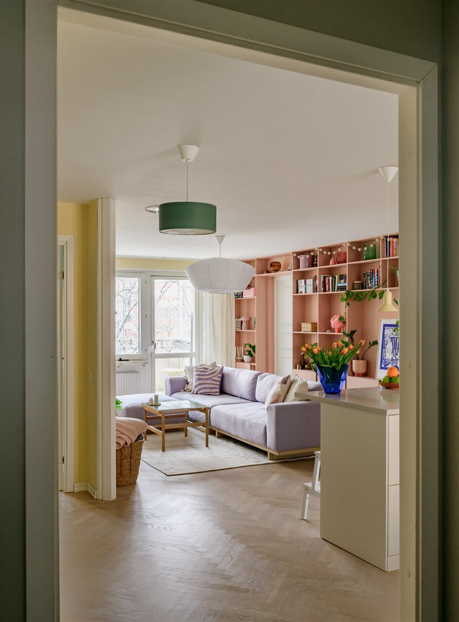 Colorful Rooms in a Bright Two-Bedroom Stockholm Apartment 9 view into yellow living room