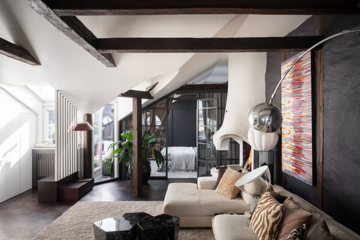 A Stylish Black and White Penthouse Apartment in Stockholm 1 attic living space wooden beams black wall