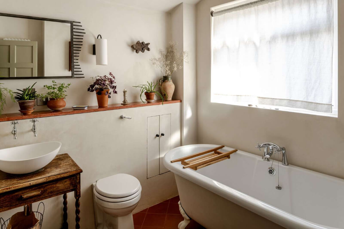 Reclaimed Materials and Custom Storage in a Serene London Home 17 bathroom clawfoot bath storage ledge