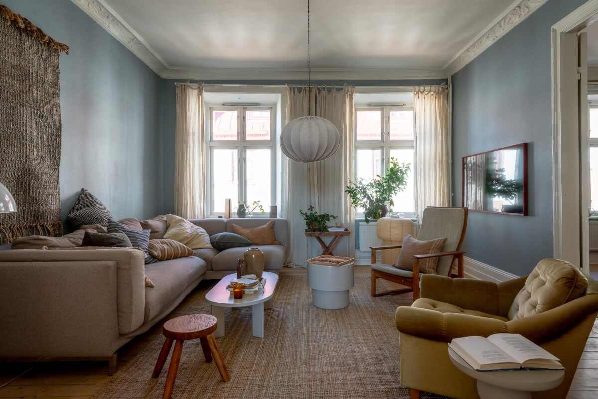A Natural Color Palette, Period Features, & Grand Rooms in a Swedish Home 1 blue living room large jute rug
