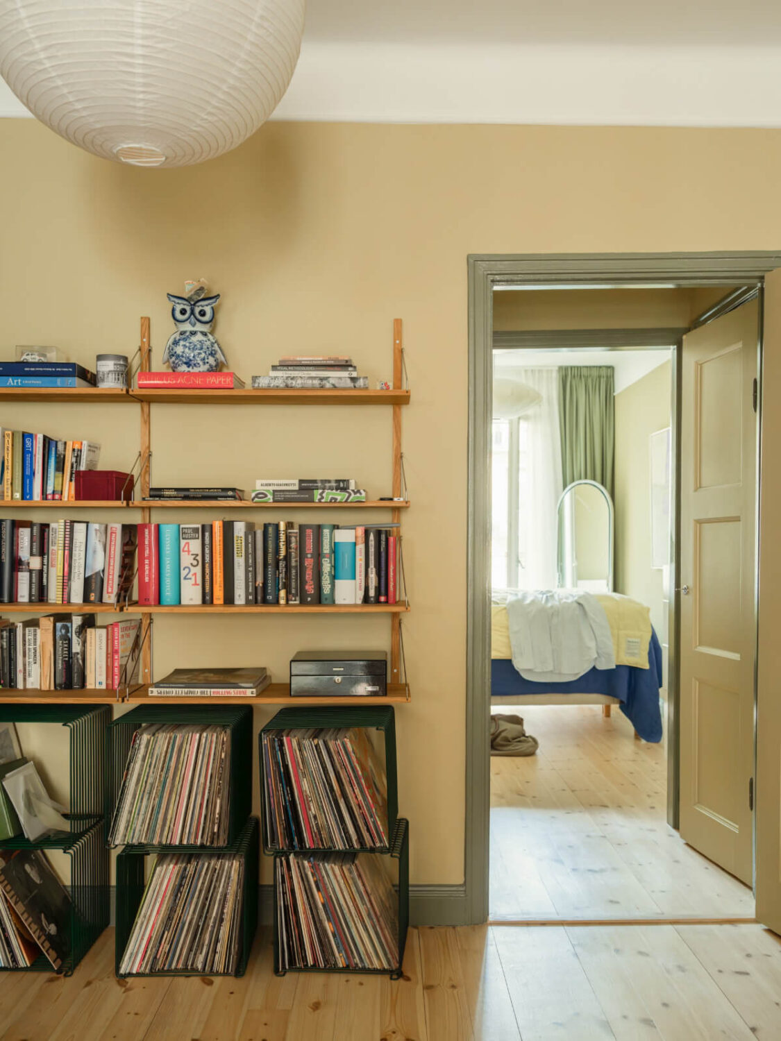 A Yellow and Green Color Palette in a Modern Swedish Apartment 14 bookshelves