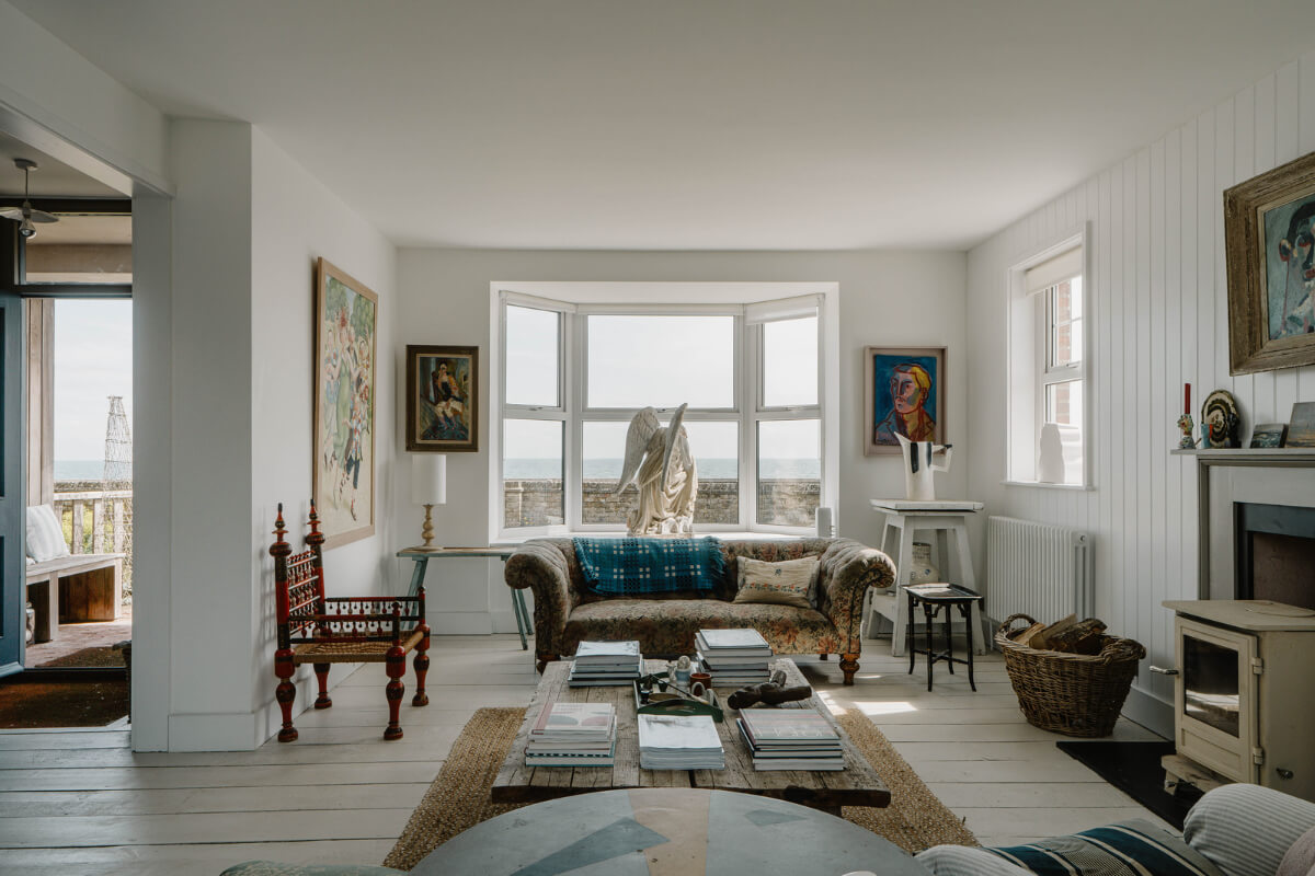 A Bright English Seaside Home Owned by Artists 1 bright living room bay window white floorboards