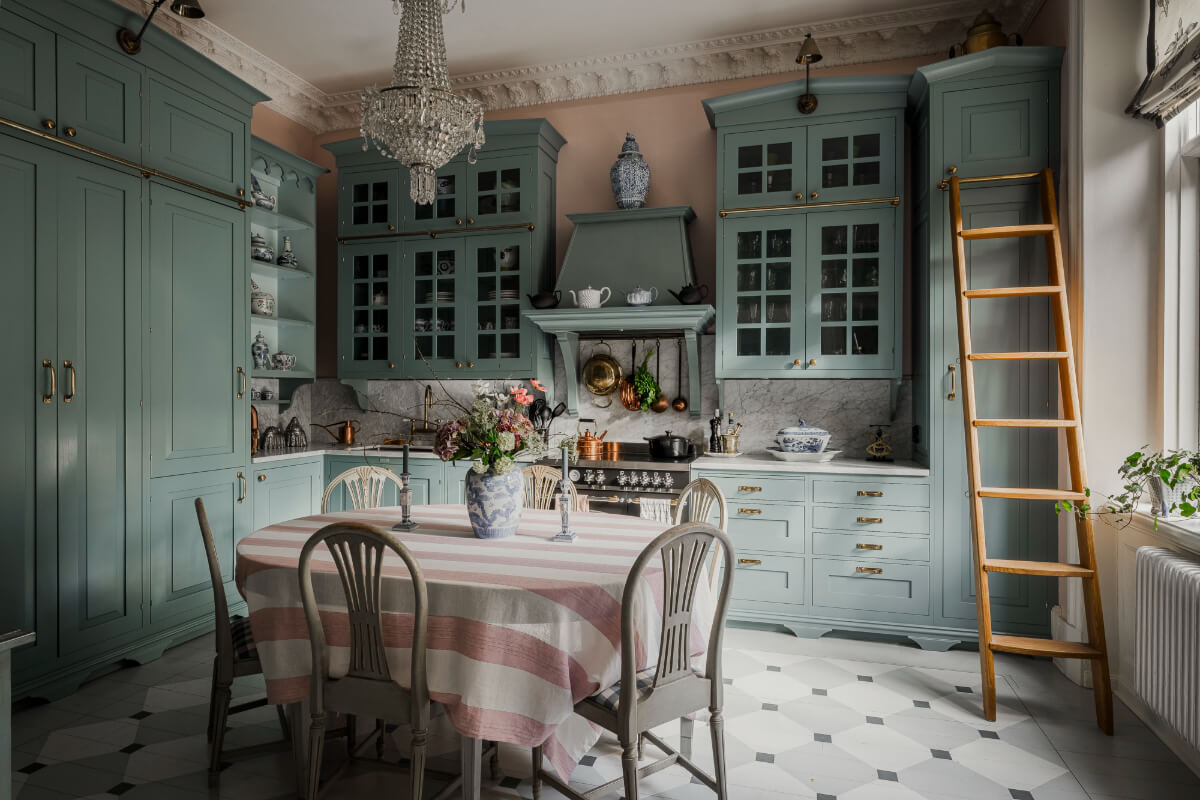 A Spectacular Kitchen and Antiques in a Late 19th-Century Apartment 2 classic blue kitchen tile floor large dining table striped tablecloth