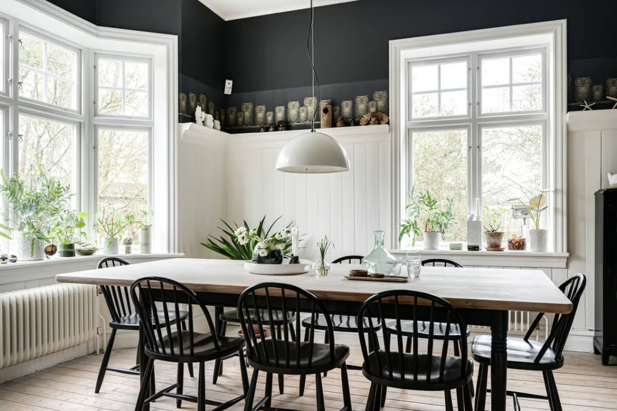 A Beautiful Former Summer House in Southern Sweden 11 dining room large wooden table bay window