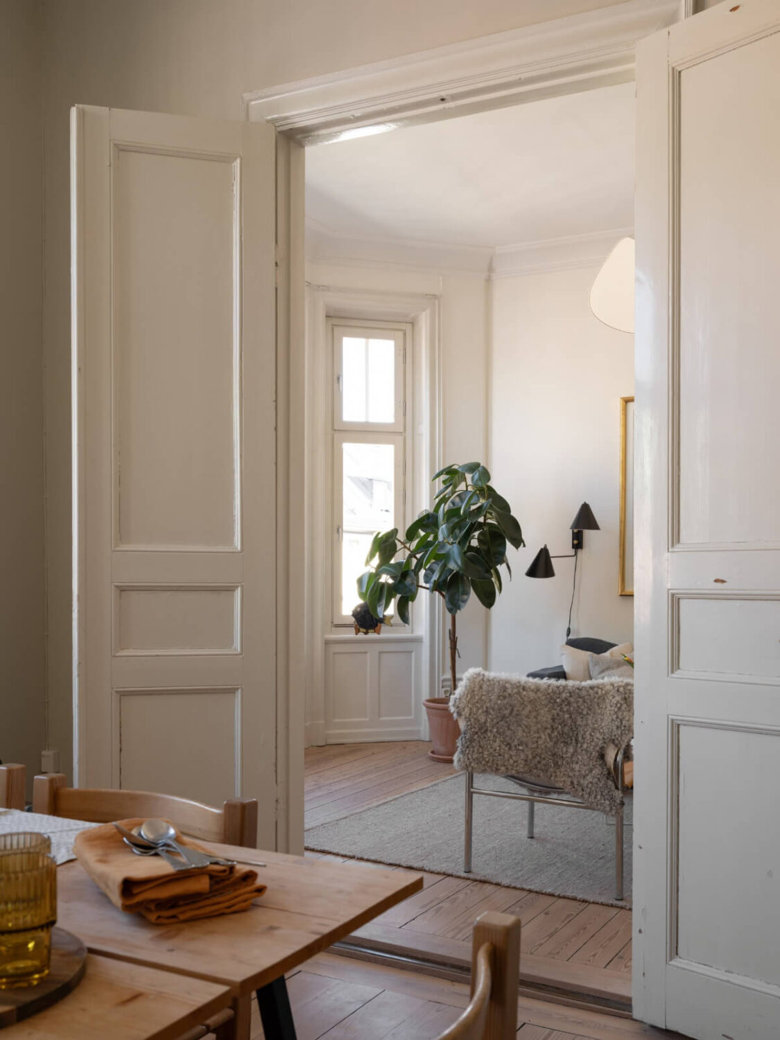 Turn-of-the-Century Charm and Site-Built Storage in a Stockholm Apartment 8 double wooden doors