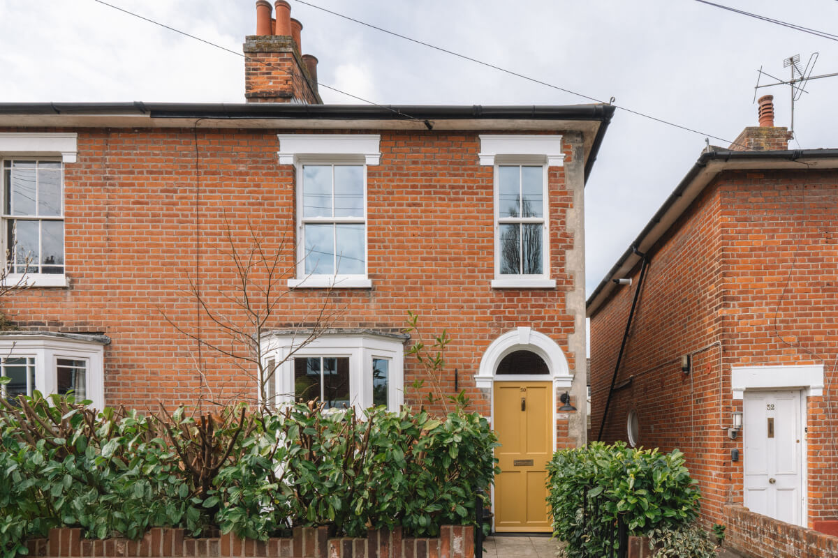 A Kitchen with Terracotta Tiles in a Renovated English Home 26 exterior yellow front door