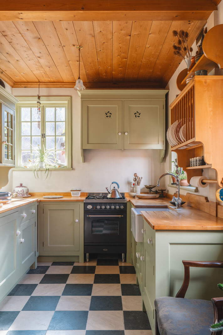 A Sage Green Kitchen in a Charming Arts and Crafts House 7 green cottage kitchen timber ceiling checkerboard floor