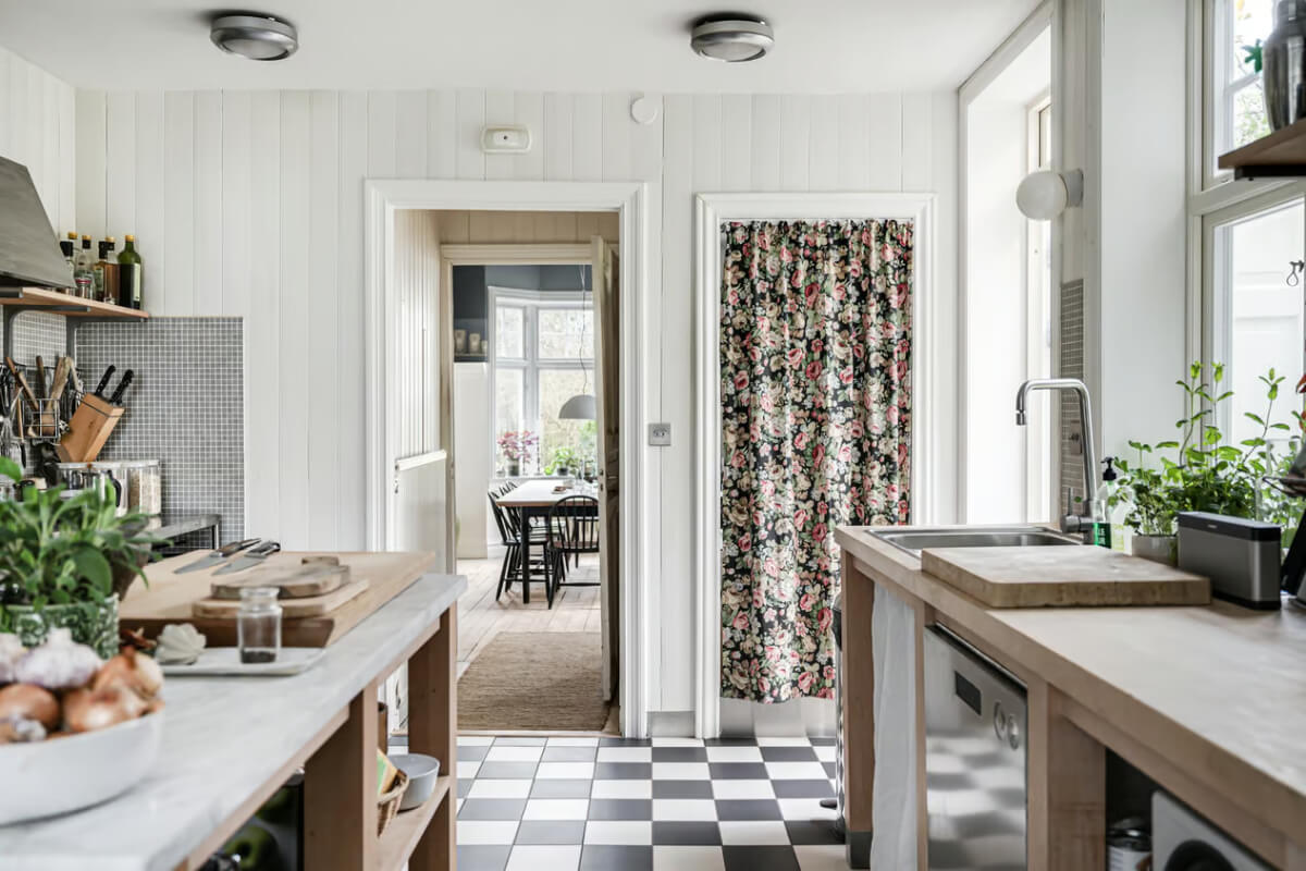 A Beautiful Former Summer House in Southern Sweden 14 kitchen checkerboard floor floral curtain pantry