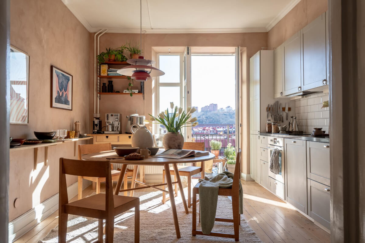 A Natural Color Palette, Period Features, & Grand Rooms in a Swedish Home 19 kitchen plaster walls round dining table shelf