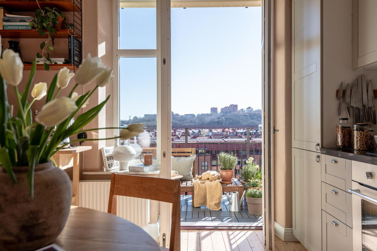 A Natural Color Palette, Period Features, & Grand Rooms in a Swedish Home 20 kitchen with balcony