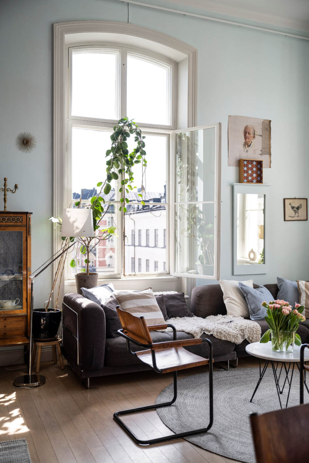 Pale Blue Walls and Huge Windows in a Swedish Loft Apartment 5 large opened window living room light blue walls