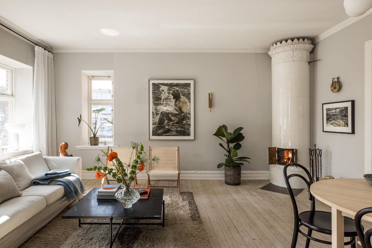 Gray Tones and a Classic Kitchen in a Swedish Apartment 3 light gray living room with fireplace