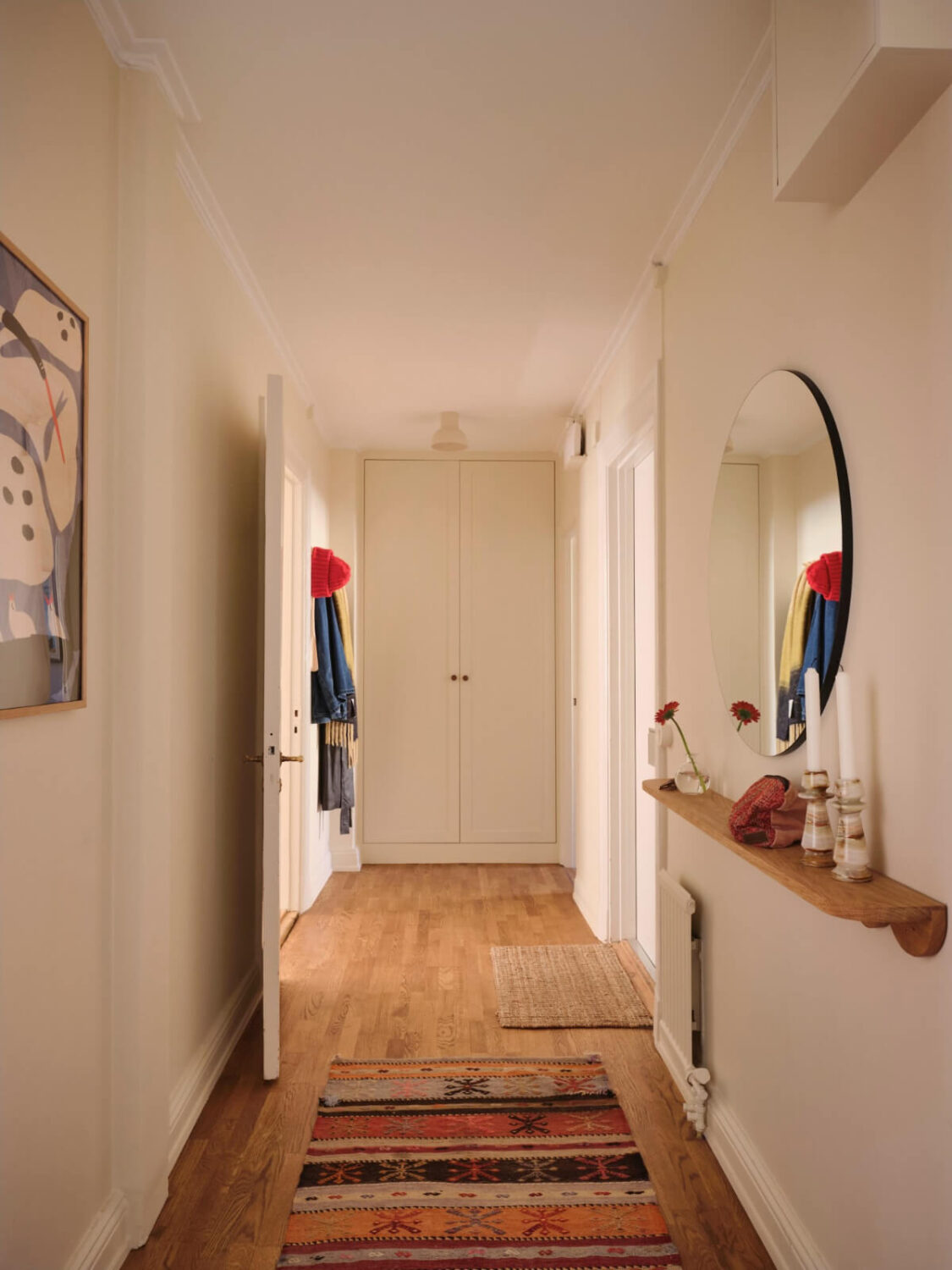 Warm, Natural Light in a Renovated Turn-of-the-Century Apartment 26 long hall built-in wardrobes round mirror