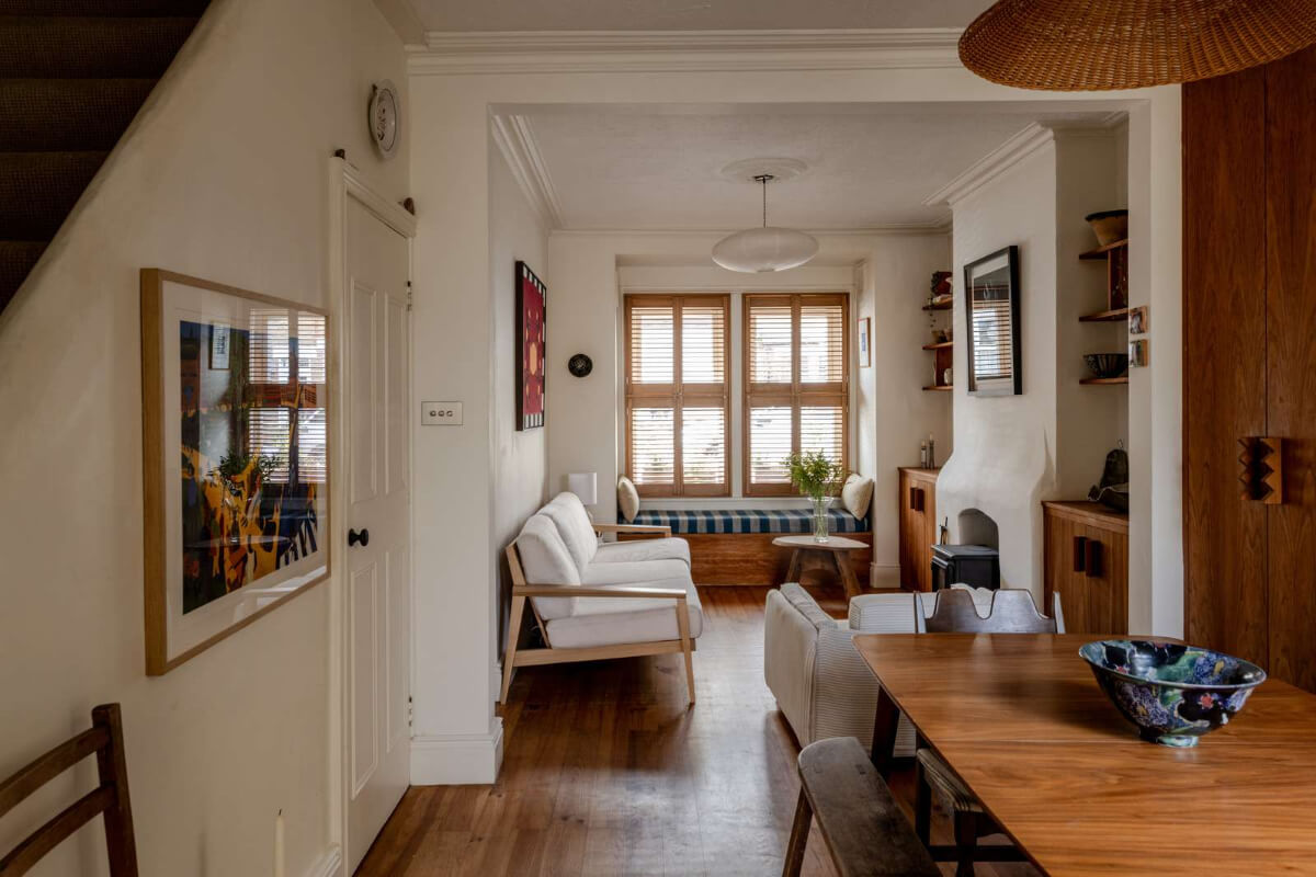 Reclaimed Materials and Custom Storage in a Serene London Home 1 open-plan-living-space-window-seat