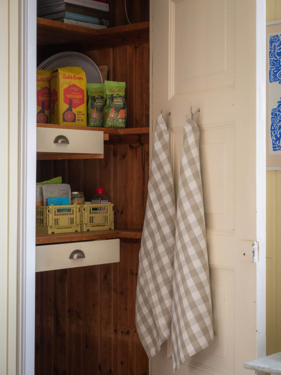 A Soft Color Palette and a Charming Kitchen in a Swedish Apartment 8 original kitchen pantry