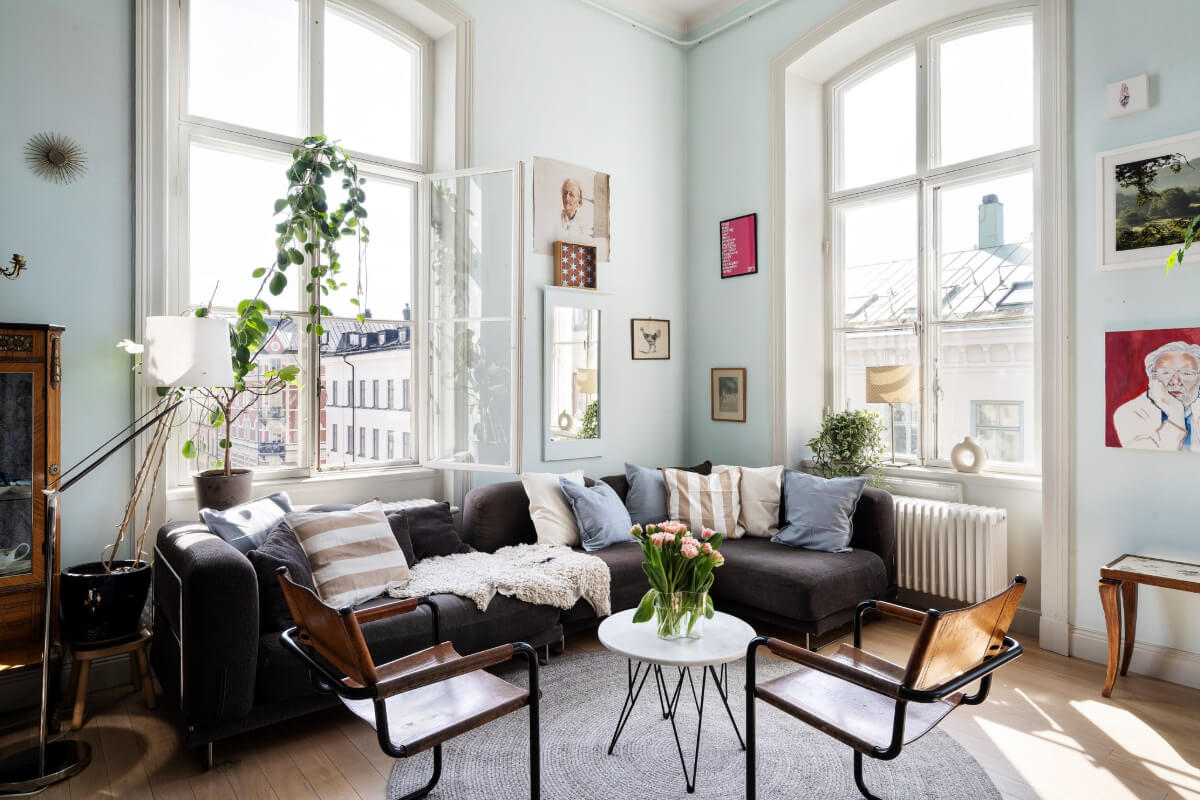 Pale Blue Walls and Huge Windows in a Swedish Loft Apartment 3 pastel blue walls living room large windows