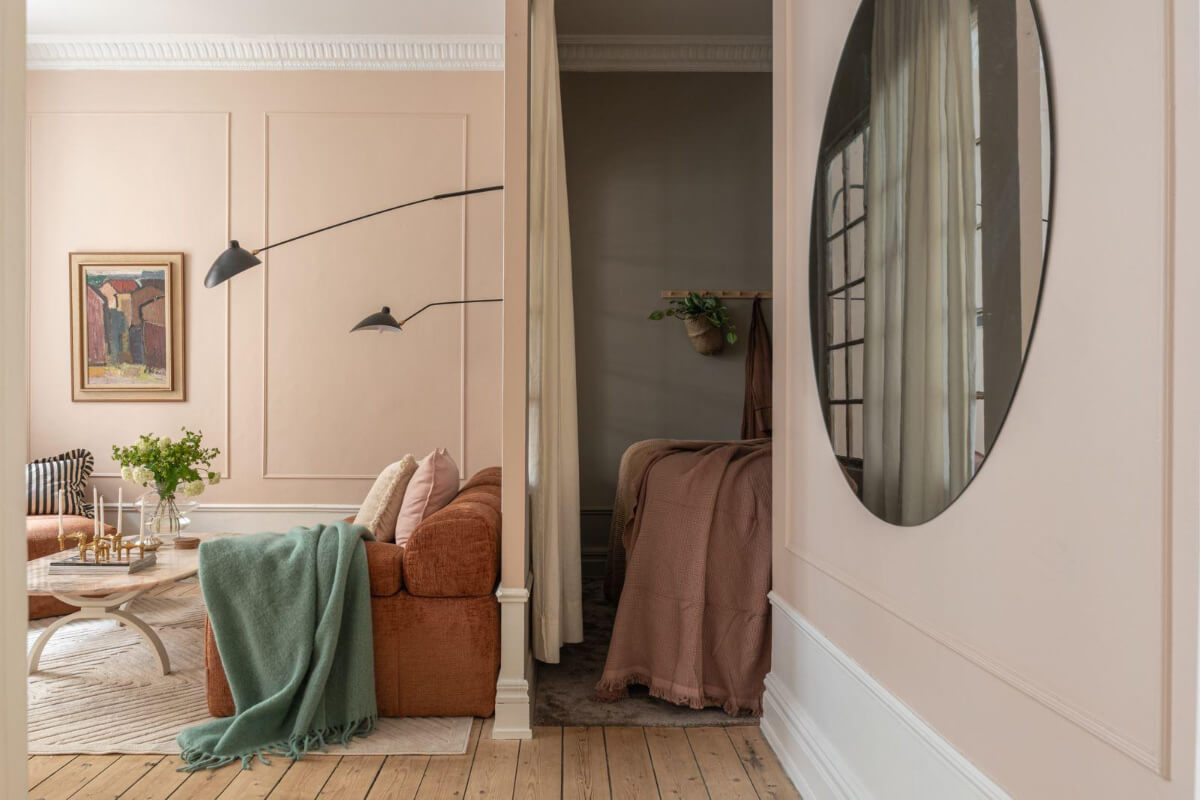 Warm Colors and Classic Elements in a Charming Studio Apartment 6 pink studio apartment with gray bedroom niche