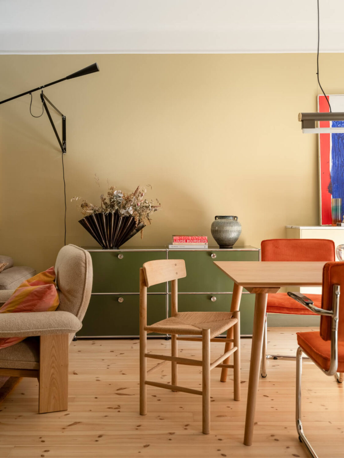 A Yellow and Green Color Palette in a Modern Swedish Apartment 2 scandinavian living room golden yellow walls